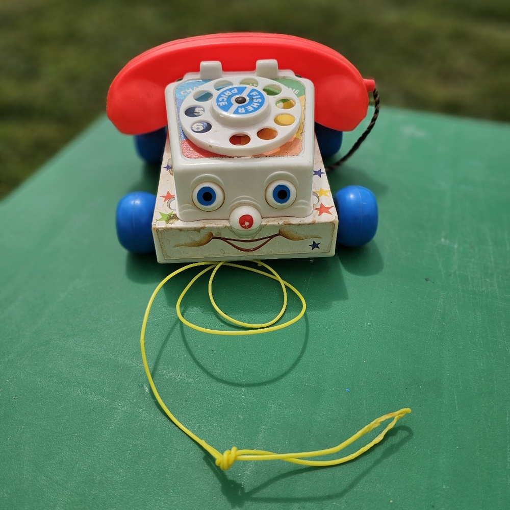 Vintage Pull-Along Toy Phone with Red and Blue Accents